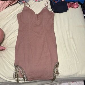 it is from haute monde its a size medium,tight, has fringe on the bottom